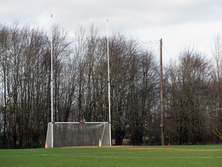 Goal post for Irish national sport hurling, rugby, camogie and football, Green grass pitch.