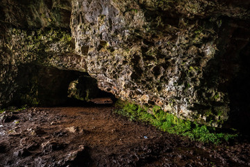Stone wall in a cave, abstract nature background and texture.