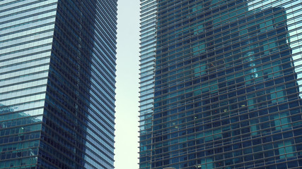 Reflecting Glass Facade of Two Modern Office Skyscrapers