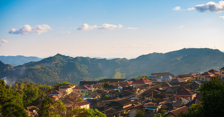 Aerial view of Phongsali, North Laos near China. Yunnan style town on scenic mountain ridge. Travel destination for tribal trekking in Akha villages. Sunset light