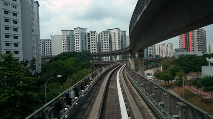 Fototapeta na wymiar Driverless LRT Train on Elevated Tracks in City of Singapore