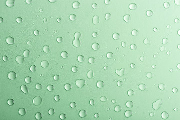 Water drops on green background. Abstract backdrop, copy spase for your text