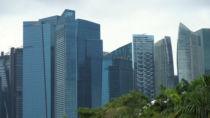 Telephoto of Glass Facade of Modern Office Skyscrapers in Finance District of Singapore