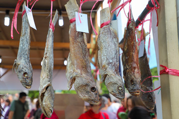 Chinese style salted fish hanging for sale in open market  in Hong Kong