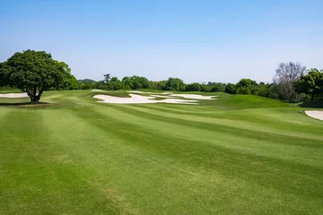 Papier peint photo  Golf Course with beautiful green field. Golf course with a rich green turf beautiful scenery.  © okimo