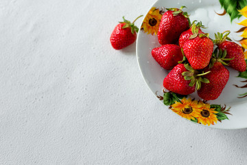 Fresh red aromatic wholesome summer berry. Strawberry. The concept of a healthy diet and agriculture.