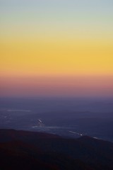 beautiful sunset with colorfully clouds at the mountain. horizon seen from high altitude