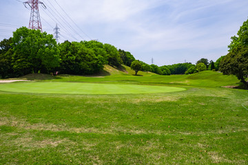 Obraz premium View of Golf Course with beautiful putting green. Golf course with a rich green turf beautiful scenery.