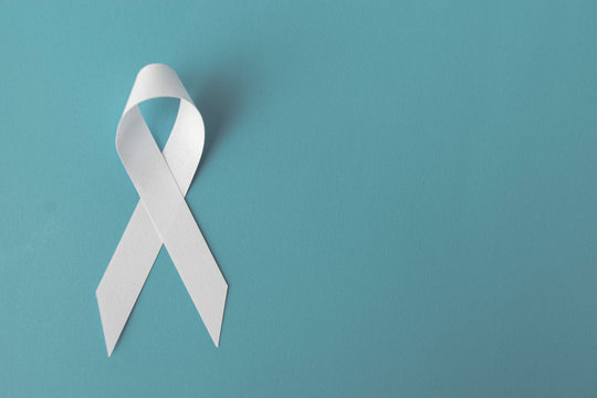 white ribbon on blue background, cancer awareness concept, hiv awareness concept, world AIDS day, world hypertension day