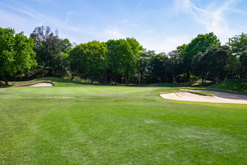 View of Golf Course with beautiful putting green. Golf course with a rich green turf beautiful scenery.