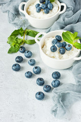 Healthy dessert: rice  pudding with  blueberry and  mint leaves