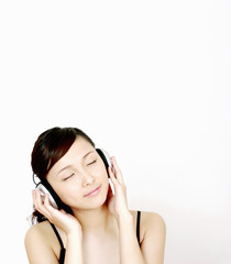 Fototapeta premium Woman listening to music on the headphones.