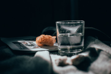 
Quartz stone and a glass of water in the sun lights