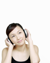 Fototapeta premium Woman listening to music on the headphones.