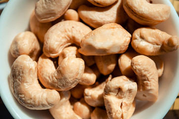 Tasty cashew nuts as background, top view