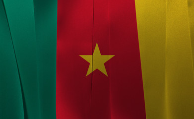 Colorful ribbon as Cameroon national flag, green red and yellow with a star.