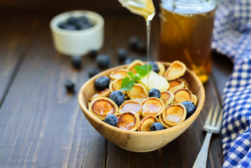 Trendy comfort food - pancakes cereal in bowl