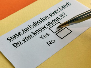 Obraz premium One person is answering question about state jurisdiction over land.