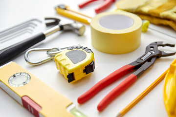 repair, building and renovation concept - different work tools on white background