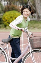 Obraz premium Girl with a bicycle.
