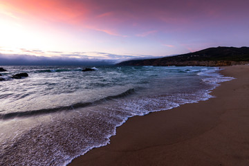 sunrise over the ocean, Cabo da Roca  on the horizon, the western point  of continental Europe
