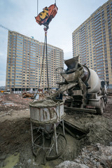 a concrete mixer pours cement into the ground at a construction site