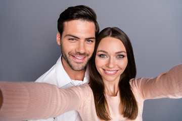 Closeup photo beautiful lady handsome guy couple good mood spend quarantine stay home together take selfies smiling cheery wear shirt pullover isolated grey color background