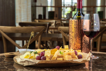 Gourmet dinner with cheese and wine in the restaurant. Romantic dinner.