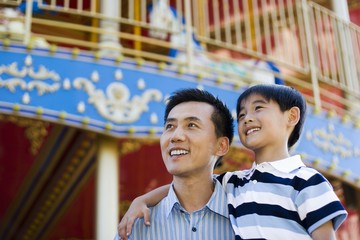 Father and son in amusement park