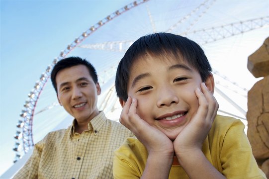 Father and son in amusement park