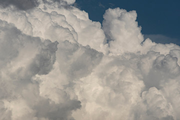 Large white and gray textured clouds.