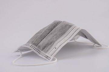 Activated carbon disposable fiber face masks isolated on white background. 