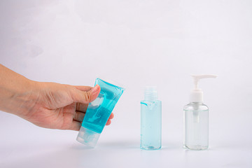 hand with alcohol gel or hand sanitizer pump bottle for washing hand in hospital or public area. 