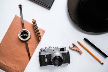Travel mock up /explore mockup with vintage camera, hat, space for text. Adventure template with retro elements, explorer kit, holiday hipster traveler mock-up. Working desk branding mock up top view.