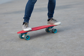 Skateboarder legs skateboarding at outdoors