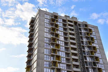 Mineral wool insulation of the facade building on construction site. Thermal protection of house. Installation double-glazed windows with frames. Modern residential buildings architecture background © MaxSafaniuk