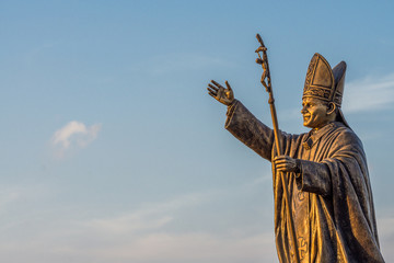 Statue of Pope John Paul II at the St. Thomas Mount National Shrine in Chennai shot during the golden hour.  - obrazy, fototapety, plakaty