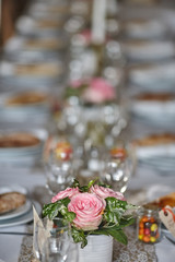 bouquet of pink roses on a wedding table, table decor