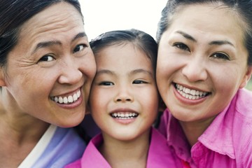 Fototapeta premium Girl posing with her grandmother and mother