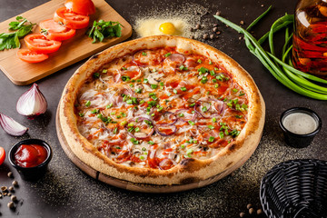 Italian Cuisine. Thin pizza with bacon, red onion, green onion and mushrooms in tomato sauce. Background image. copy space