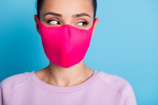 Closeup photo of pretty lady keep social distance citizen look side empty space see handsome guy sympathizing flirting wear protect bright face mask sweater isolated blue color background