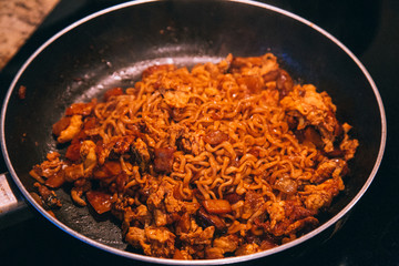 frying noodles and vegetables