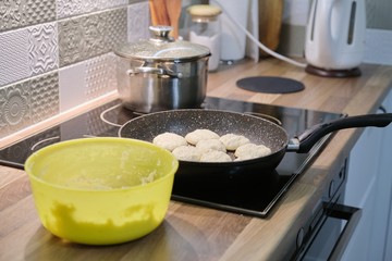 Homemade food, process of cooking frying in pan of cheesecakes, curd pancakes