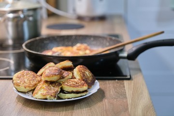 Homemade food, process of cooking frying in pan of cheesecakes, curd pancakes