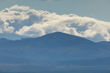 Landscape of mountains with clouds in the Moncayo area and the Iberian mountain system, looking towards Cabezo de Los Frailes in the Tabuenca area, Talamantes, near Borja, Zaragoza province.