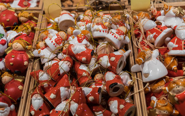 Fototapeta na wymiar Small Santa Claus and angels, the famous Christmas Souvenirs