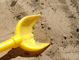 Small Shovel In The Sand.