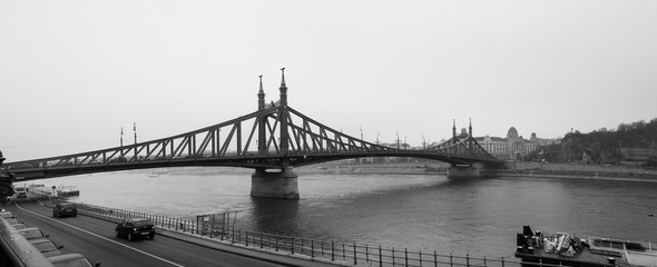 Large panoramic view of Liberty Bridge at foggy morning. Budapest Hungary,