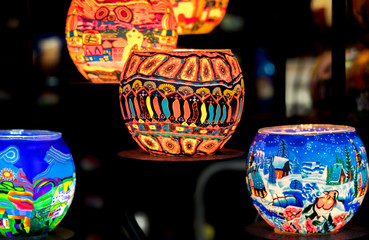 Fototapeta na wymiar Christmas souvenirs painted candle holders for sale at tradition Christmas market in Budapest