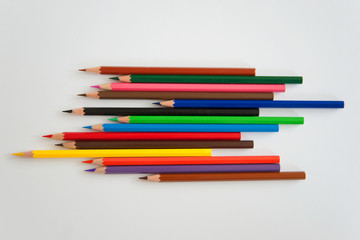 colored pencils on white background